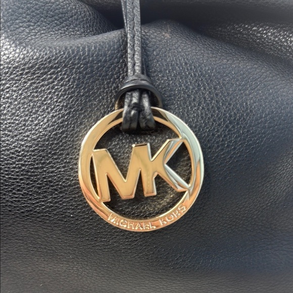 The image shows a Michael Kors Colgate Reversible Grab Bag in black. - Picture 6 of 11